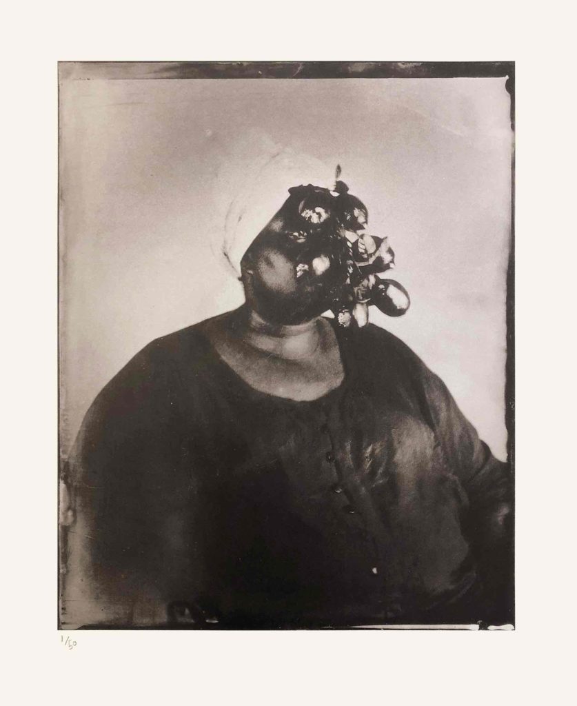 Alt-text: Khadija Saye with several dark and light oval shapes in front of her face